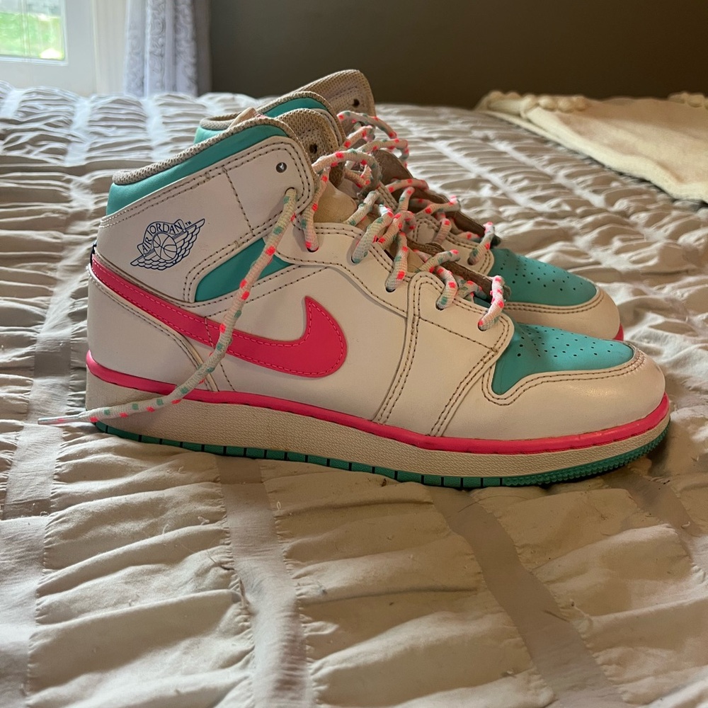 Nike Air Jordan Mid Rise Sneakers with White, Pink, and Teal Accents